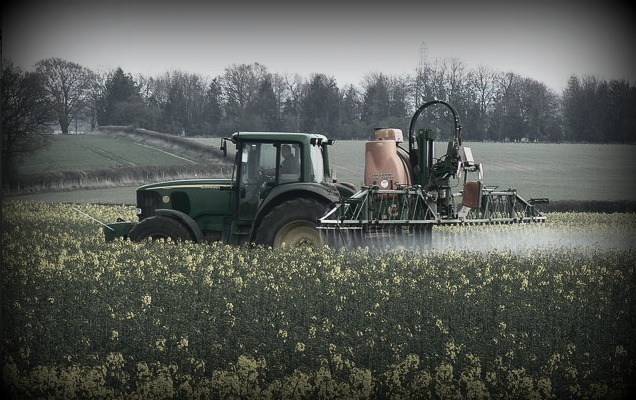 tractor applies pesticides